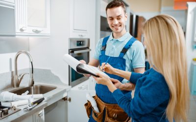 male-plumber-and-female-customer-in-the-kitchen.jpg